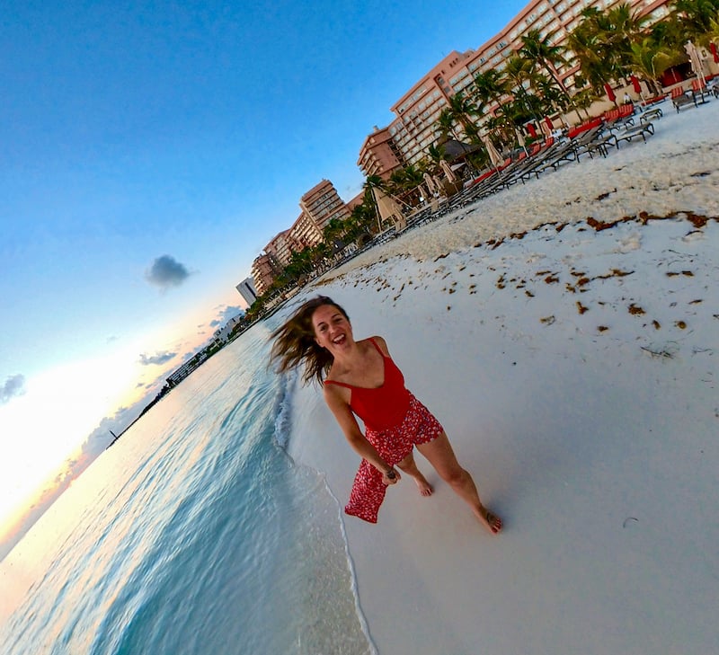 solo female traveler on the beach in Cancun