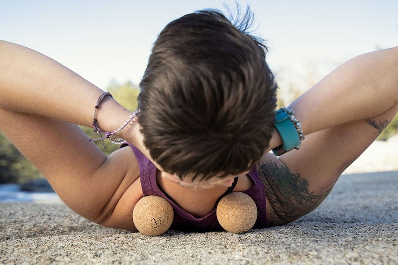 solo female traveler using cork massage balls