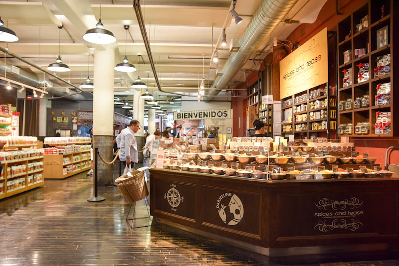 person roaming around the stalls of Chelsea Market in NYC on a cold winter day